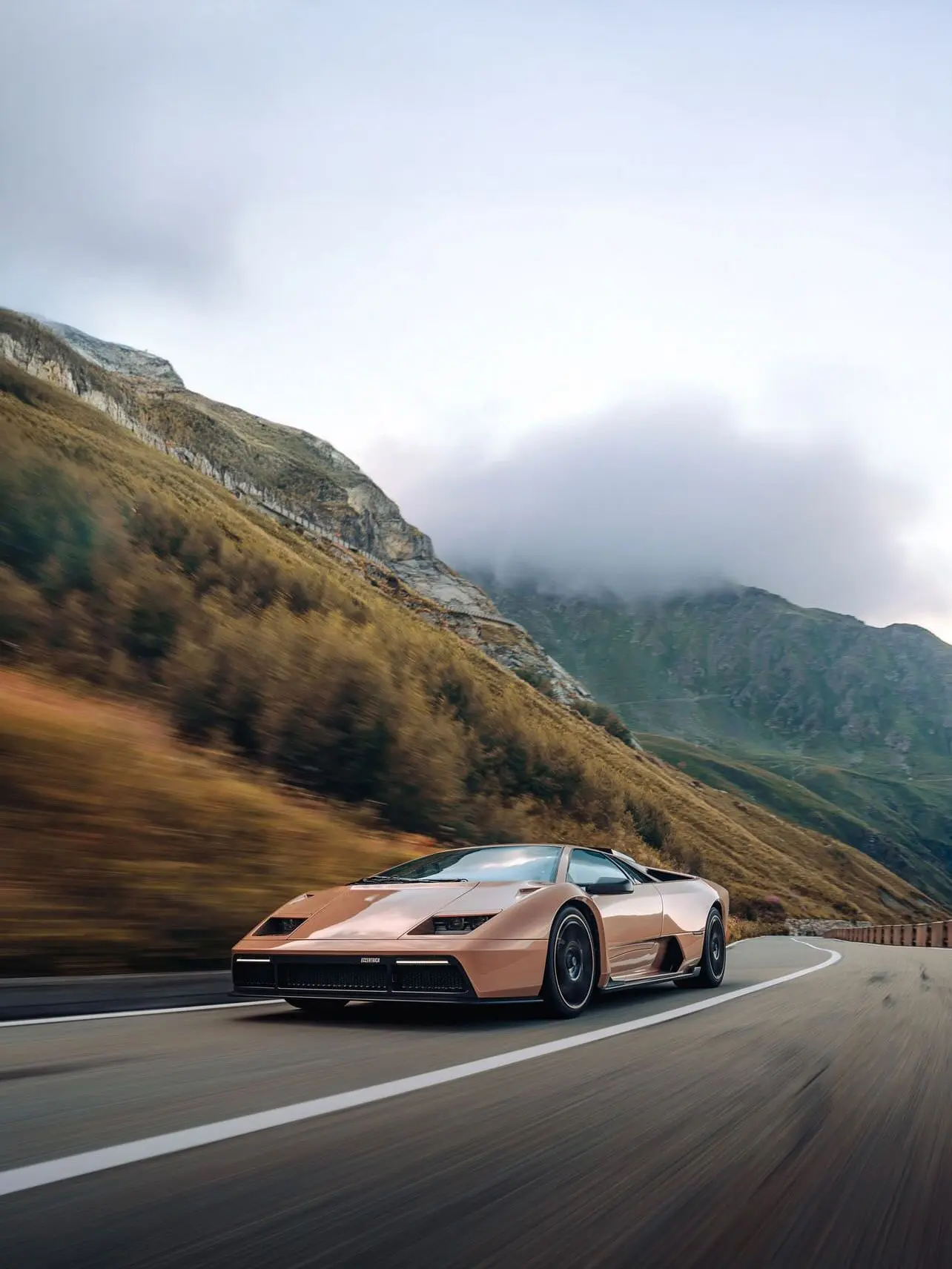 Eccentrica V12 in motion on a mountain road